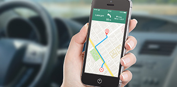 Person using mobile phone directions map application